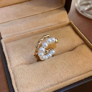Elegant gold plated double layer pearl ear cuff with a vintage twisted rope design
