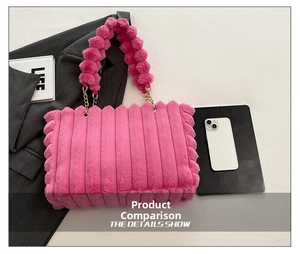 Detailed close-up of pink faux fur tote bag with plush ball charms and gold chain handles