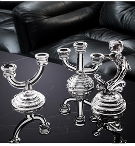 Macro detail of Nordic glass candle holder set showing clear texture on black marble