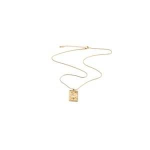 Close-up of gold snake chain with rectangular embossed pendant and small gemstone