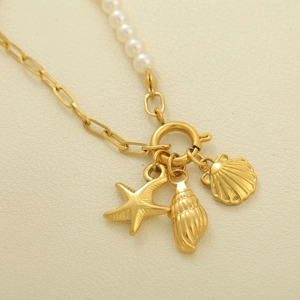 French vintage gold necklace with white pearls and sea star conch shell charms