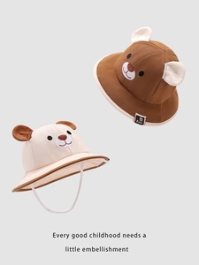 Detail showing two cute bear ear bucket hats for children in brown and cream beige colors