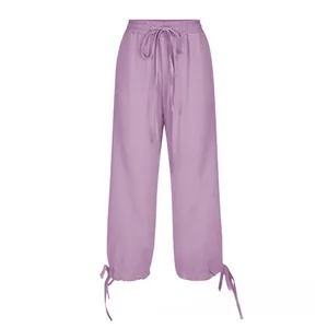 Detailed view of the mauve linen blend trousers with adjustable drawstring hem and elastic waist