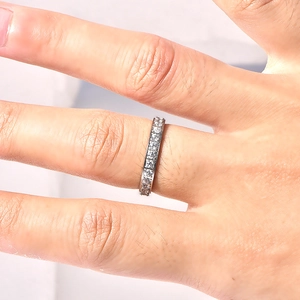 Macro shot of silver eternity ring with pavé-set round brilliant cubic zirconia stones
