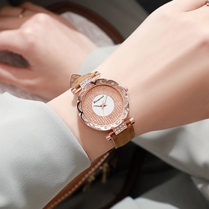 Women's rose gold quartz watch with rhinestone bezel and brown leather strap
