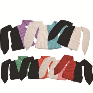 Detailed grid of knitted rabbit ear beanies showing diverse two-tone color combinations