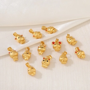 Golden Chinese zodiac animal charms with matte finish on white silk fabric background