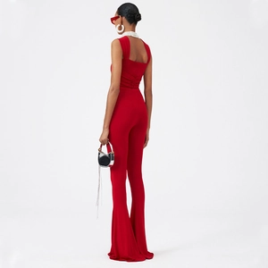 Detailed back view of red flared jumpsuit with ruched waist and wide straps
