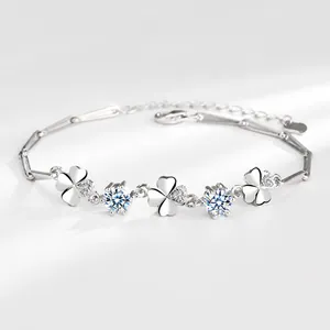 Close-up of S925 silver four-leaf clover bracelet with crystal stones and bamboo chain