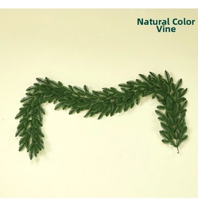 Detail of deep green artificial pine garland with dense needle texture for Christmas