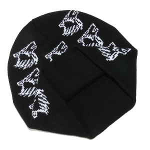 Detailed view of black ribbed knit beanie featuring white jacquard graffiti pattern