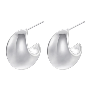 Macro shot of polished silver teardrop earrings with a glossy finish and hollow design