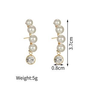 Detailed view of pearl and rhinestone drop earrings with dimensions 3.7cm by 0.8cm