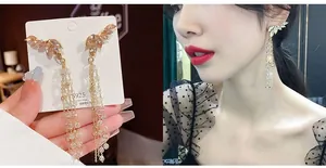 Detail of S925 silver fringe earrings with champagne crystals and pearl tassels