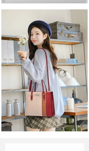 Close-up of contrast color handbag showing premium PU leather texture and shoulder strap