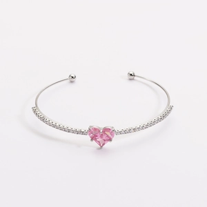Elegant silver-plated cuff bangle with a sparkling pink heart-shaped zircon stone.