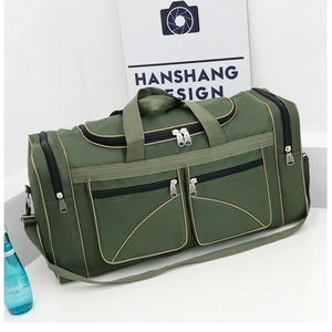 Detail of army green travel bag featuring multiple zipper pockets and detachable shoulder strap
