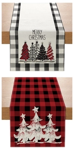 Detail of Christmas table runners with Merry Christmas text and festive tree patterns