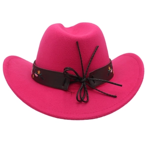 Detail of rose pink felt cowboy hat featuring floral embroidery on a brown leather band