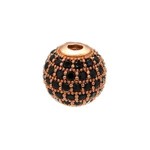 Macro view of rose gold micro-pave bead with black diamonds for DIY jewelry making