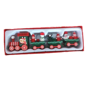 Detail of wooden Christmas train set with Santa figures in a red gift box packaging