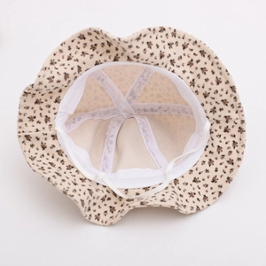 Detail of floral baby sun hat with internal white lining and elastic adjustable chin strap