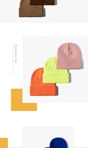 Detail of colorful knitted beanies showing fine texture and elastic rolled edges