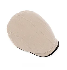 Top view of beige herringbone newsboy cap with black brim trim and woven texture