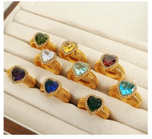 Detailed collection of gold textured rings with colorful heart-shaped gemstones