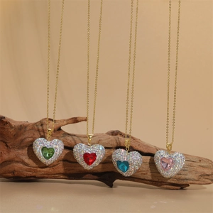 Elegant gold necklaces with colorful heart pendants in green, red, blue, and pink zirconia