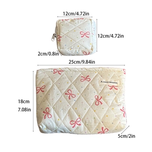 Detailed size specifications of pink bow polka dot quilted travel pouches in two sizes