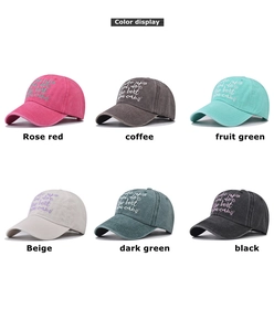 Detailed view of six vintage washed cotton baseball caps with embroidered motivational text