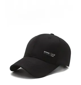 Detail of a black cotton baseball cap showing SPORT CAP metal emblem and stitching