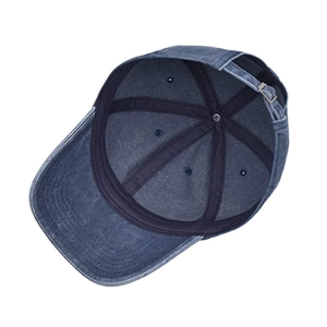 Detail view of washed cotton baseball cap showing internal stitching and metal buckle