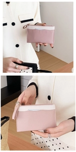 Close-up of pink and white lychee texture PU leather coin purse with golden zipper