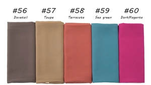 Detail view of pearl chiffon hijabs in Dovetail, Taupe, Terracotta, Sea Green, and Magenta