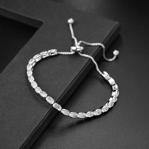 Detail of adjustable silver tennis bracelet with marquise-cut white cubic zirconia
