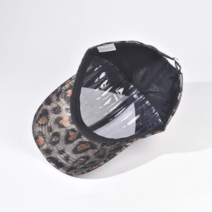 Detail view of leopard print baseball cap interior with sweatband and 100% polyester label
