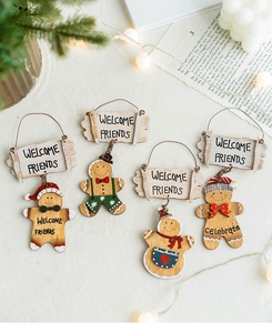 Close-up of wooden gingerbread man welcome signs with natural texture and rustic rope