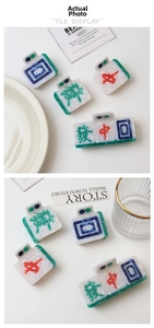 Detailed view of Mahjong-inspired claw clips in marble texture acetate material