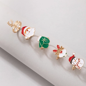 Five-piece Christmas ring set featuring Santa, snowman, and reindeer in gold-tone metal