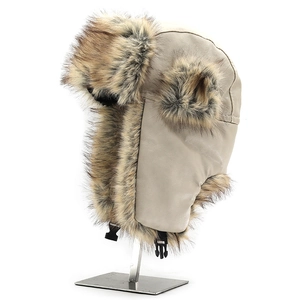 Detail of grey leather trapper hat with thick brown faux fur lining and buckle
