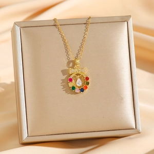 Golden wreath necklace with colorful zircon gemstones and butterfly bow pendant on silk