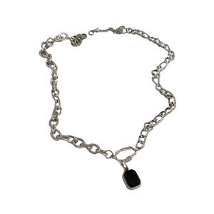 Minimalist silver chain necklace with a black rectangular pendant in a bold link design
