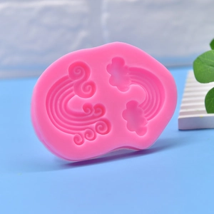 Pink silicone mold featuring 3D rainbow and cloud relief for DIY candle and soap making