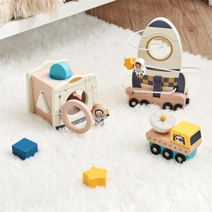 Detailed set of wooden space toys including rocket bead maze and shape sorter for toddlers