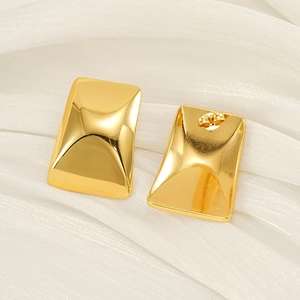 Minimalist 18k gold plated rectangular earrings on white silk fabric background