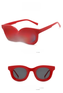 Macro view of vintage red cat-eye sunglasses with grey lenses from side and front angles