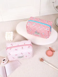 Chic checkered makeup bags with bow details and sturdy zippers in a stylish setup