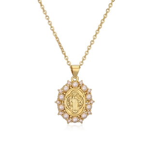 Gold plated necklace with Saint Benedict medallion and white pearl border on white background